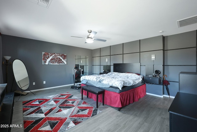 bedroom featuring ceiling fan and hardwood / wood-style floors