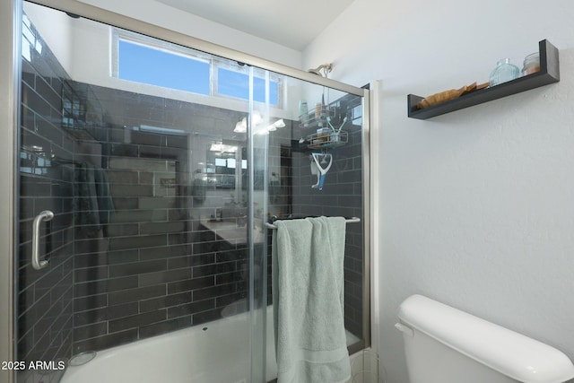 bathroom with toilet and an enclosed shower