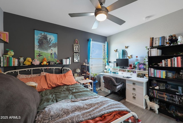 bedroom with ceiling fan and light hardwood / wood-style floors