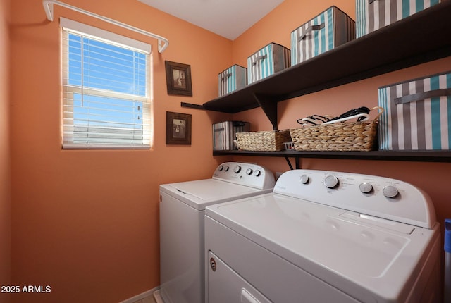 laundry room with washing machine and clothes dryer