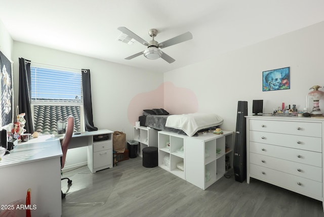 bedroom with ceiling fan and light hardwood / wood-style floors