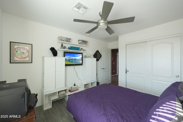 bedroom with ceiling fan, a closet, and dark hardwood / wood-style flooring