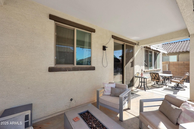 view of patio / terrace featuring an outdoor fire pit