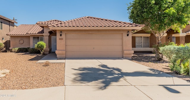 mediterranean / spanish-style house featuring a garage