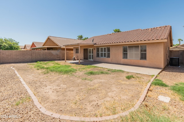 rear view of property featuring a patio area