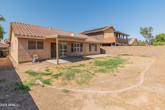 rear view of house featuring a patio