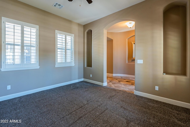 4120 E Woodside Way, Gilbert, AZ 85297 - spare room featuring a ceiling fan, carpet, and arched walkways