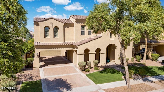 4120 E Woodside Way, Gilbert, AZ 85297 - mediterranean / spanish home featuring a tiled roof, decorative driveway, stucco siding, and a garage
