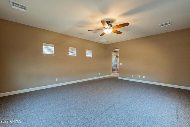 4120 E Woodside Way, Gilbert, AZ 85297 - empty room with ceiling fan, arched walkways, and carpet floors