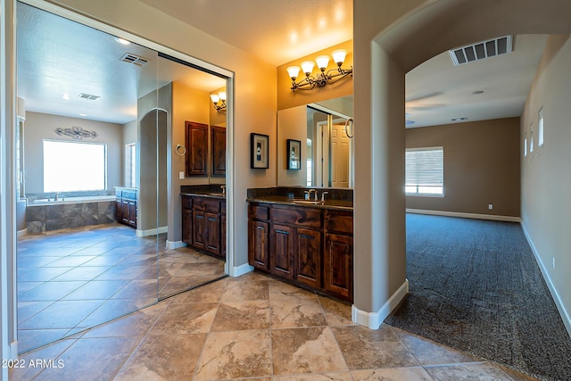 4120 E Woodside Way, Gilbert, AZ 85297 - full bath with vanity, a garden tub, and a ceiling fan