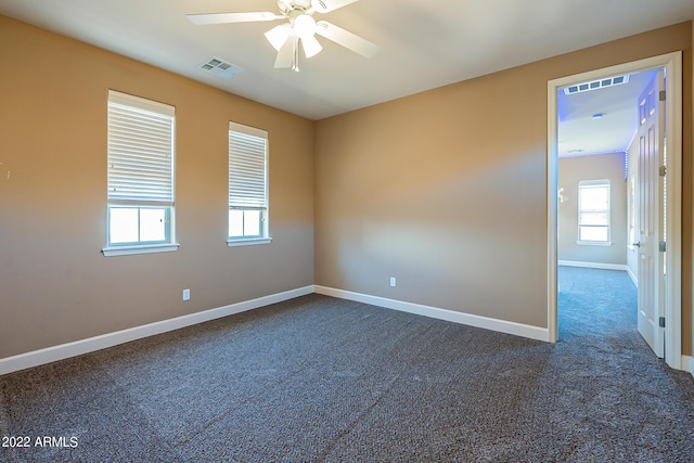 4120 E Woodside Way, Gilbert, AZ 85297 - empty room with a ceiling fan, dark colored carpet, and plenty of natural light