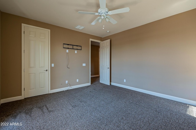 4120 E Woodside Way, Gilbert, AZ 85297 - unfurnished bedroom featuring dark carpet and a ceiling fan