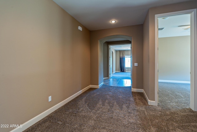 4120 E Woodside Way, Gilbert, AZ 85297 - hall with arched walkways, dark colored carpet, and recessed lighting