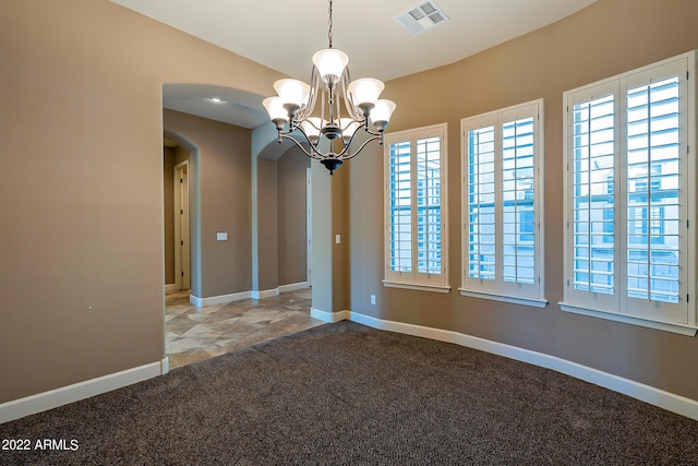 4120 E Woodside Way, Gilbert, AZ 85297 - unfurnished room featuring arched walkways, carpet flooring, and a chandelier