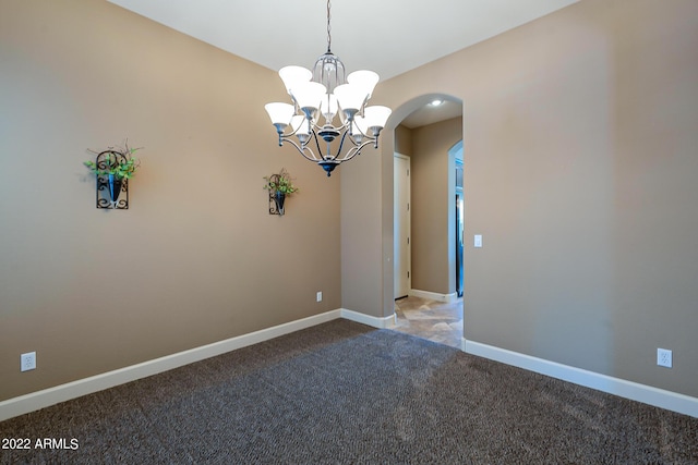 4120 E Woodside Way, Gilbert, AZ 85297 - carpeted empty room featuring arched walkways and a chandelier
