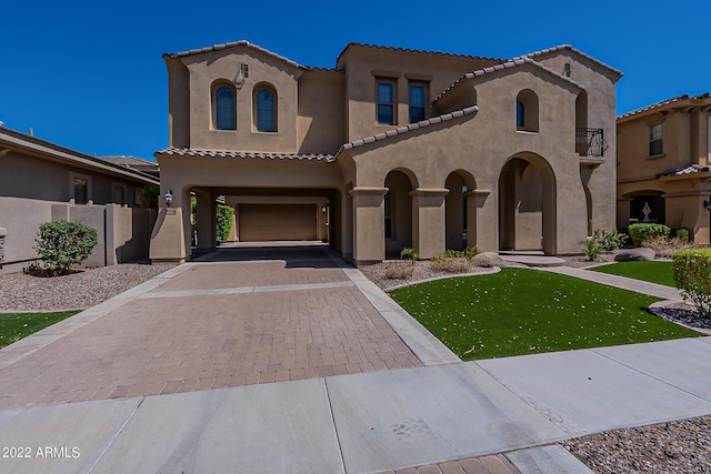 4120 E Woodside Way, Gilbert, AZ 85297 - mediterranean / spanish house with an attached garage, stucco siding, a tile roof, decorative driveway, and a front yard