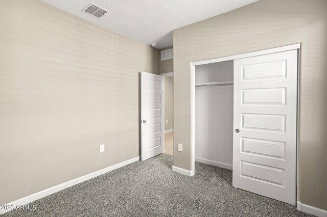1471 S 239th Dr, Buckeye, AZ 85326 - unfurnished bedroom with carpet, a closet, and baseboards
