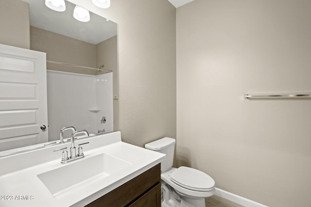 1471 S 239th Dr, Buckeye, AZ 85326 - full bathroom featuring toilet, a shower, vanity, and baseboards