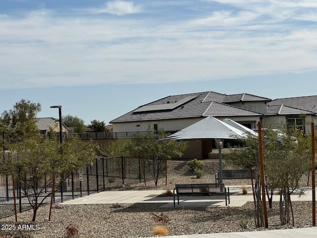 surrounding community with a patio area and fence