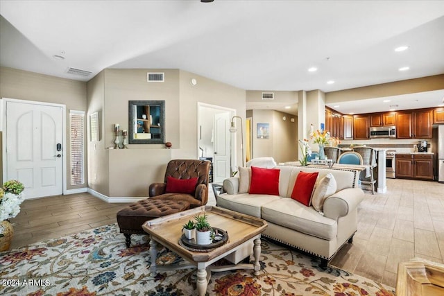 living room with light hardwood / wood-style flooring