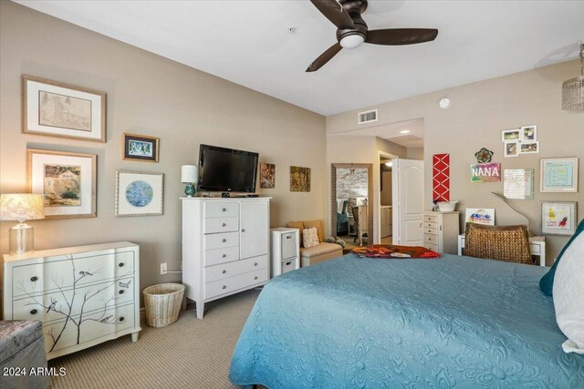 bedroom with ceiling fan and light colored carpet