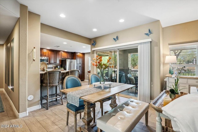 dining room with light wood-type flooring