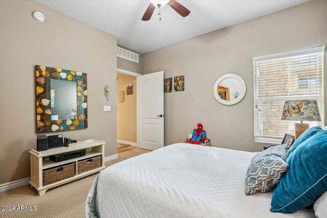 carpeted bedroom featuring ceiling fan