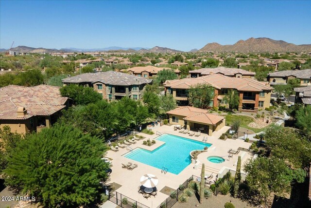 view of swimming pool featuring a mountain view and a patio