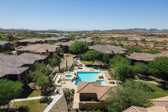 birds eye view of property featuring a mountain view