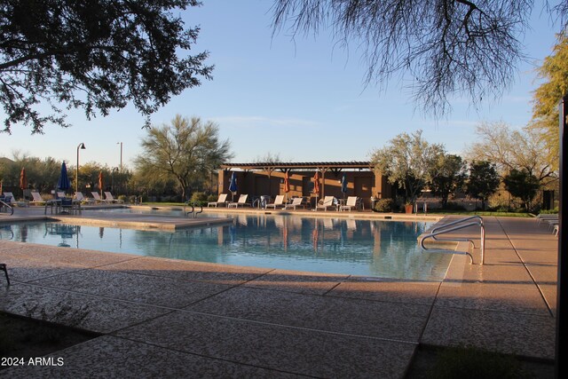 view of swimming pool with a patio