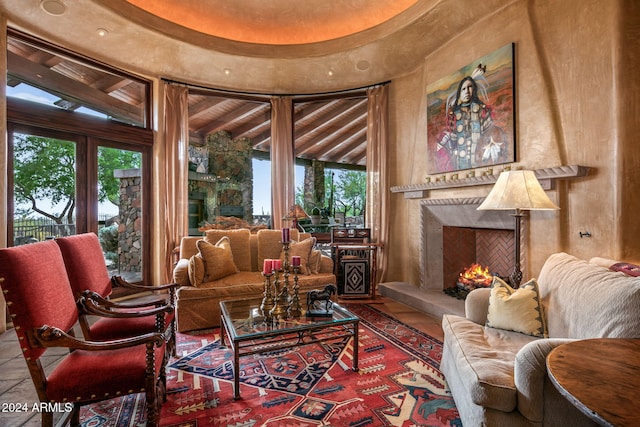 sitting room with a fireplace and tile patterned floors