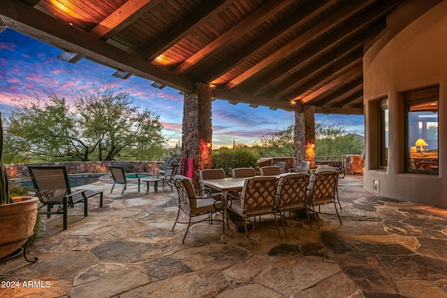 view of patio terrace at dusk