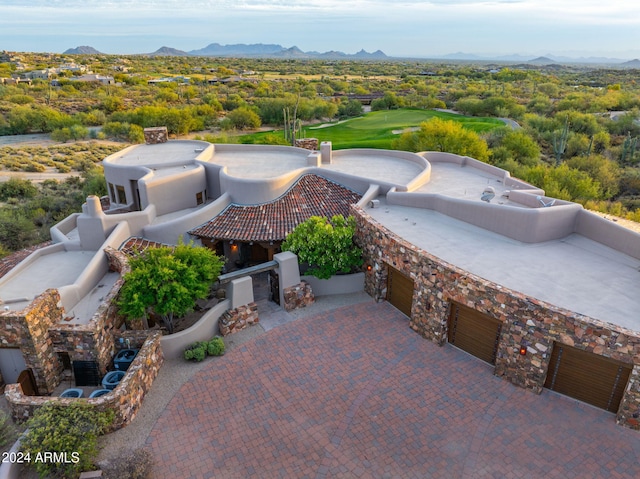 birds eye view of property with a mountain view