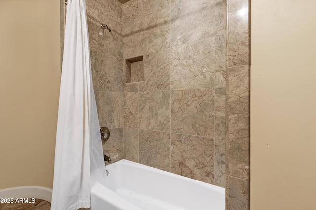 bathroom with shower / tub combo with curtain