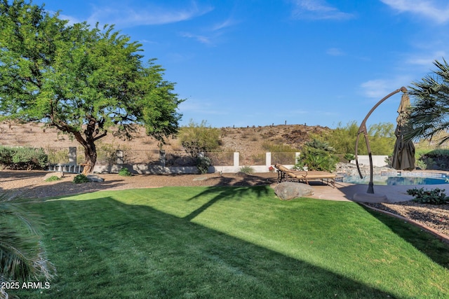 view of yard featuring a patio area and fence