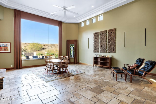 dining area featuring baseboards, recessed lighting, a high ceiling, a ceiling fan, and stone tile flooring