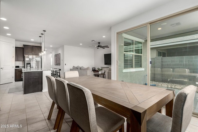 dining area featuring light tile patterned flooring, a ceiling fan, and recessed lighting