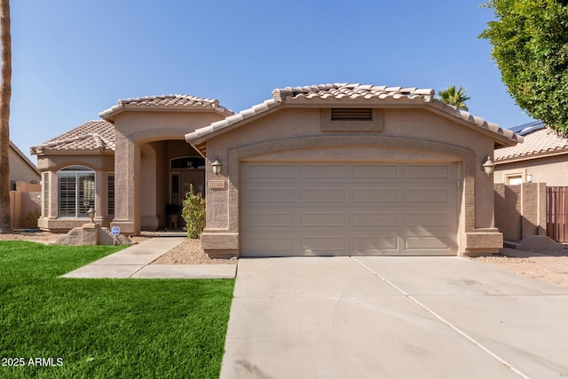 mediterranean / spanish-style home with a garage