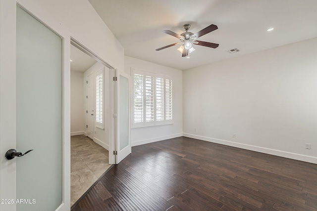 4067 S White Dr, Chandler, AZ 85249 - spare room featuring ceiling fan, dark wood-type flooring, and baseboards