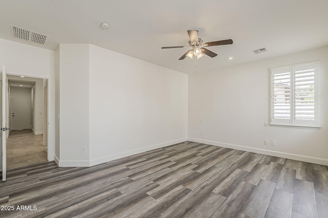 4067 S White Dr, Chandler, AZ 85249 - empty room featuring ceiling fan, wood finished floors, recessed lighting, baseboards, and a smoke detector