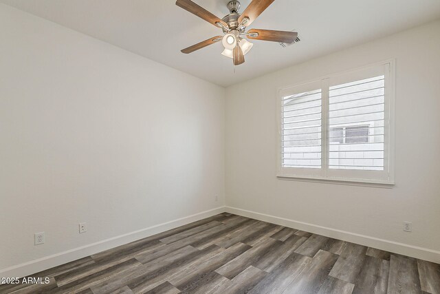 4067 S White Dr, Chandler, AZ 85249 - spare room with dark wood finished floors, ceiling fan, and baseboards