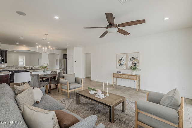 4067 S White Dr, Chandler, AZ 85249 - living room featuring arched walkways, a ceiling fan, recessed lighting, baseboards, and a chandelier