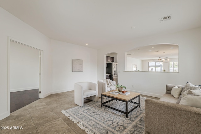 4067 S White Dr, Chandler, AZ 85249 - living room with arched walkways, recessed lighting, and baseboards