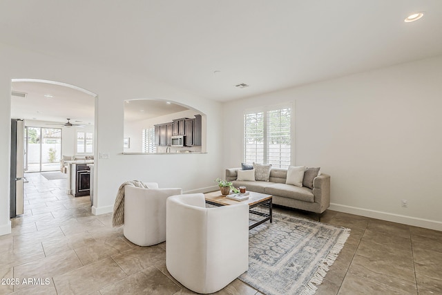 4067 S White Dr, Chandler, AZ 85249 - living area with baseboards, recessed lighting, a ceiling fan, and arched walkways