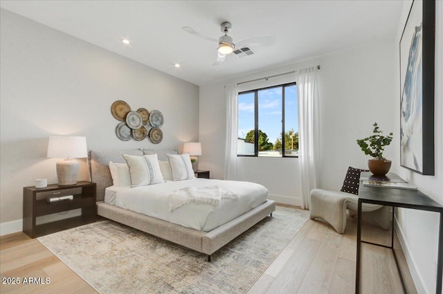 bedroom with ceiling fan and light wood-type flooring