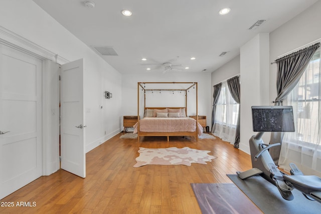 bedroom with recessed lighting, baseboards, visible vents, and light wood finished floors