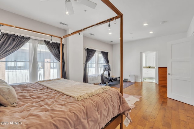 bedroom featuring ceiling fan, light wood-type flooring, visible vents, and recessed lighting