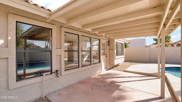 view of patio / terrace with a fenced in pool and fence