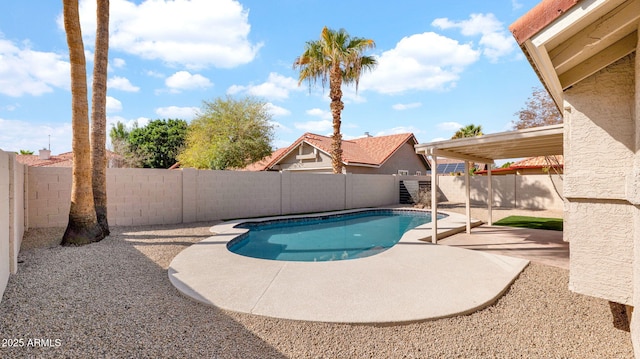 view of swimming pool featuring a patio area, a fenced backyard, and a fenced in pool