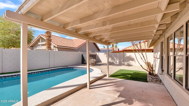 view of pool featuring a fenced in pool, a patio area, and a fenced backyard